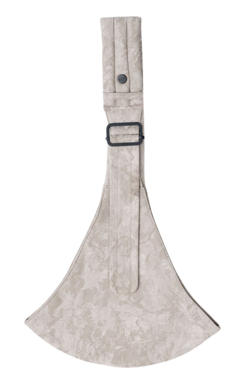 The Mabē Monarch Toddler Sling in Ashland Camo, which is light gray camouflage-patterned cotton/linen fabric.