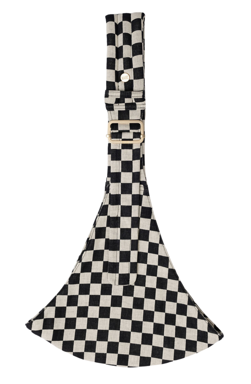 The Mabē Monarch Toddler Sling in Ebony Check, which is checker-patterned black and natural cotton/linen fabric.