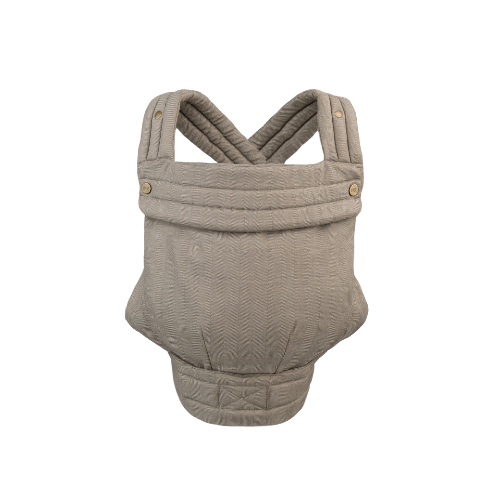 An image of the Mabē Monarch Buckle Carrier in  Charles Herringbone, which is a delicate herringbone weave in shades of brown. There are antique bronze branded buttons on the quilted head support flap, crossing padded shoulder straps, and a quilted waistband. The background is solid white.