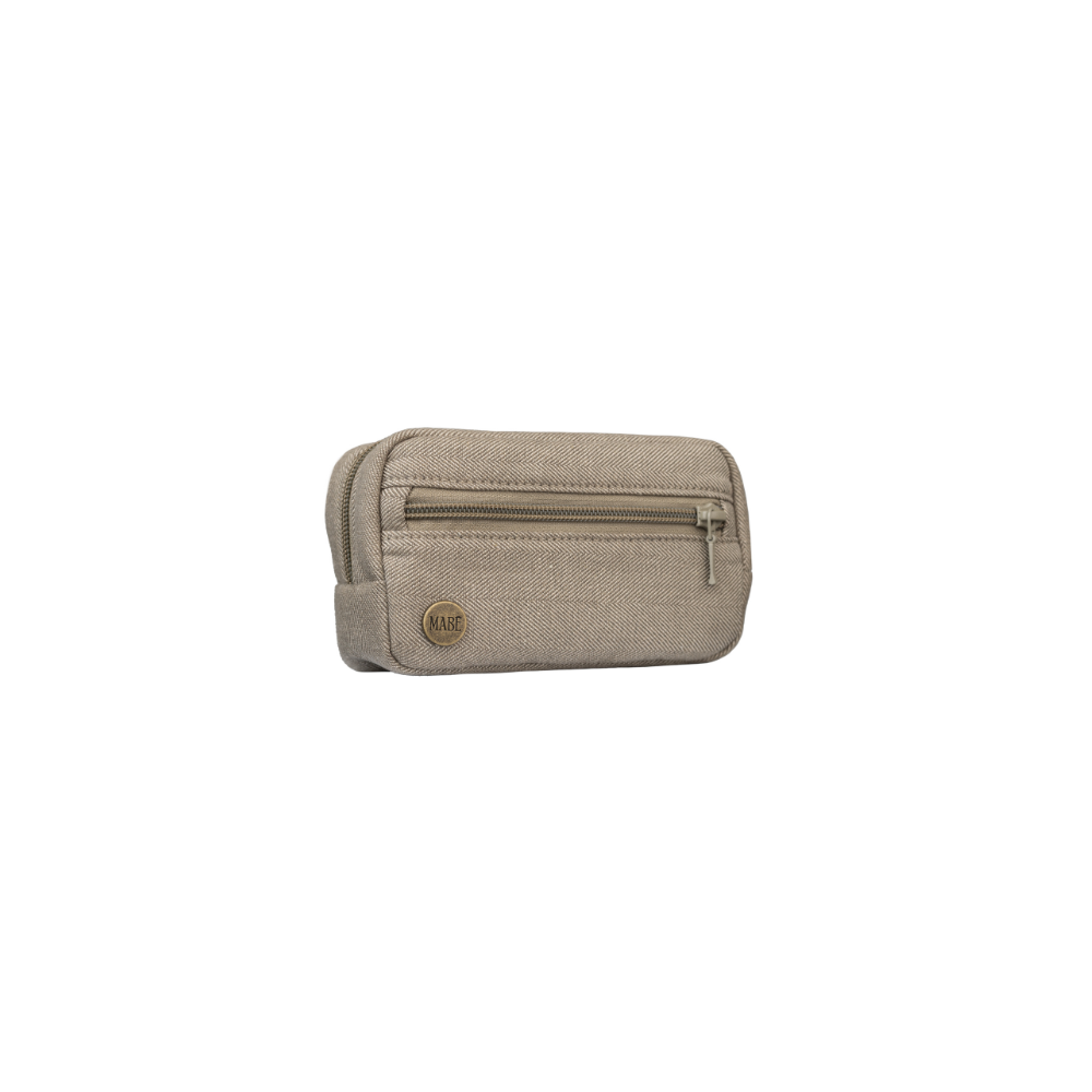 Photo of the Mabē Monarch Accessory Bag in Charles Herringbone, which is a delicate herringbone weave in shades of brown. There is an antique bronze branded button on the lower left of the bag, and two zippered pockets.