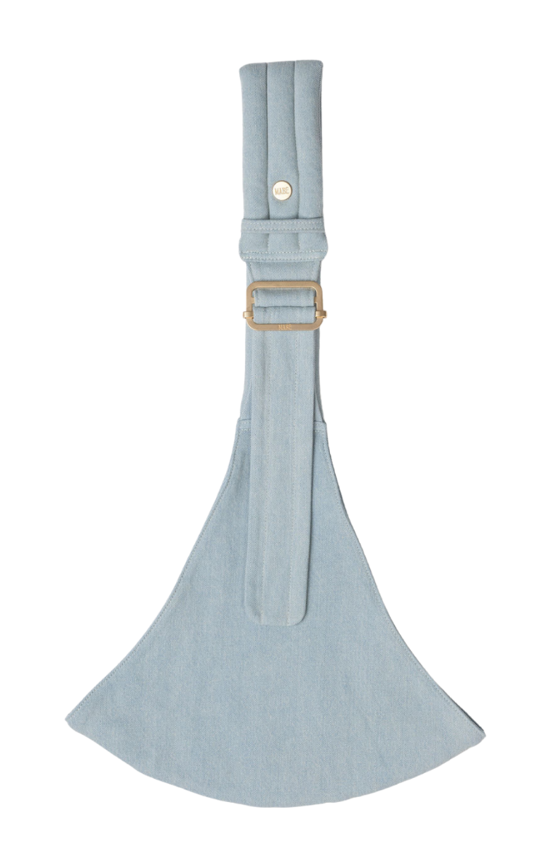 The Mabē Monarch Toddler Sling in Dream Wash Denim, which is solid light blue cotton denim fabric.